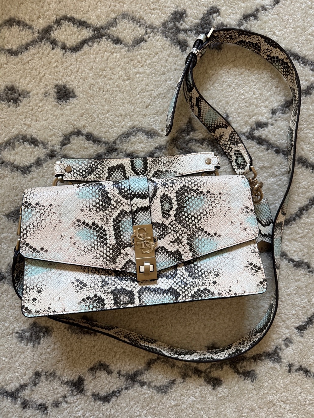 Snake-Print Crossbody Bag in cream &  black with Pale Blue Accents.